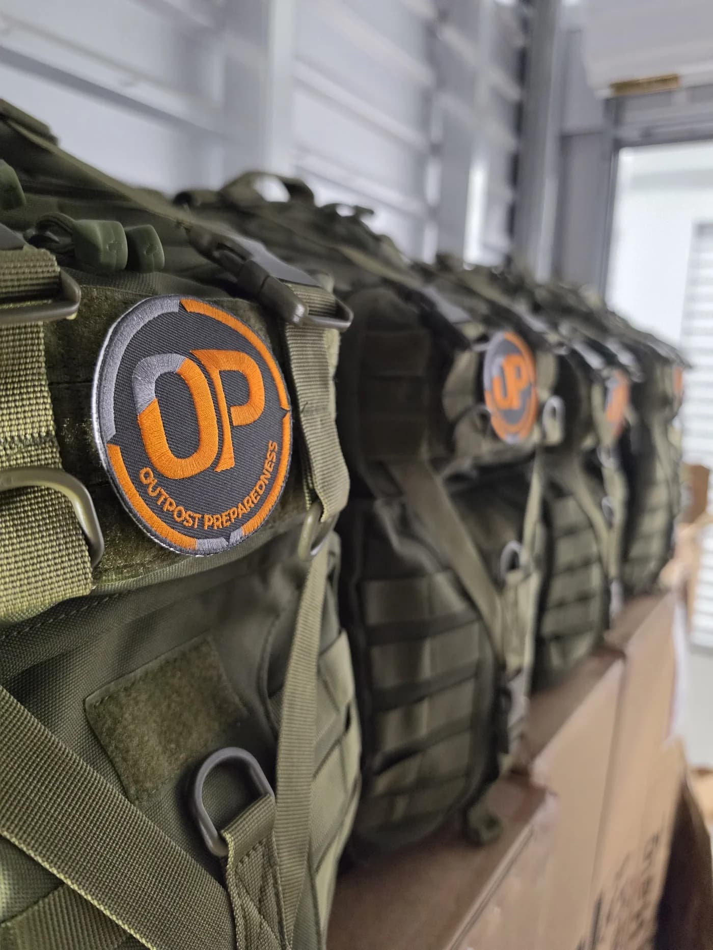 Close detail of the Outpost patch on a packed go-bag