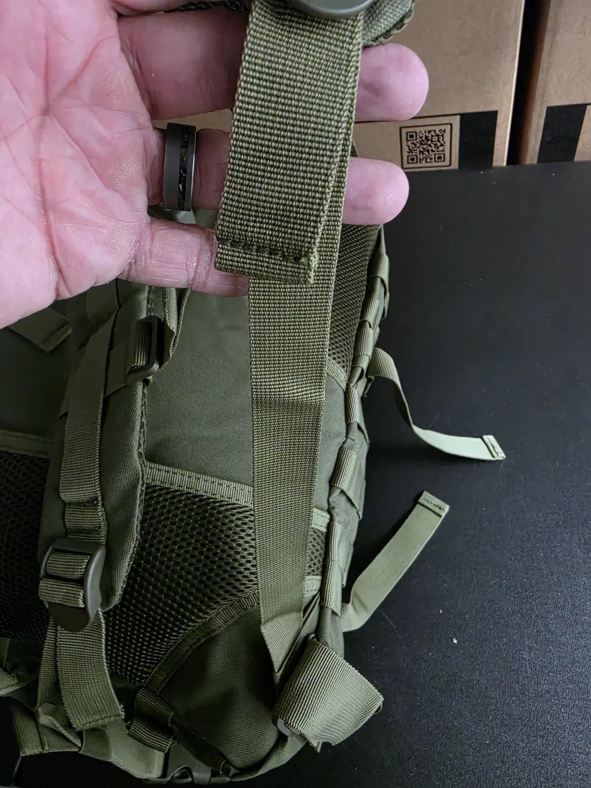 Shoulder strap and adjustment hardware on the Outpost go-bag