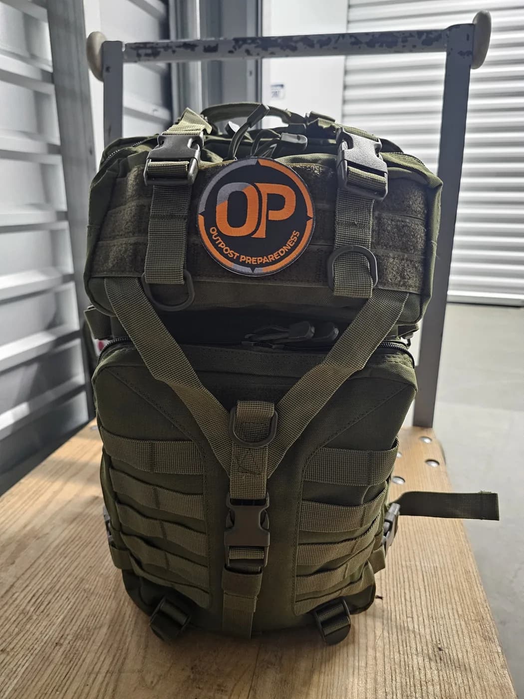 A packed Outpost Essential+ Go-Bag on the workbench, OP patch forward