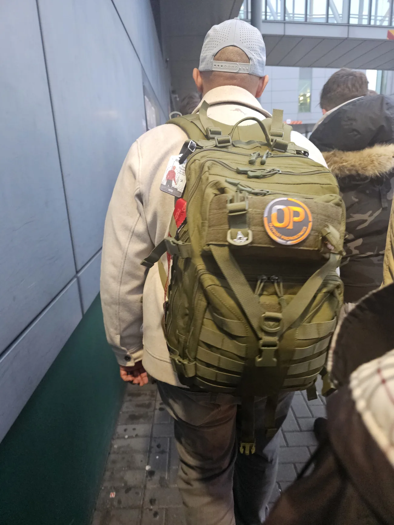 An Outpost go-bag worn on a jet bridge