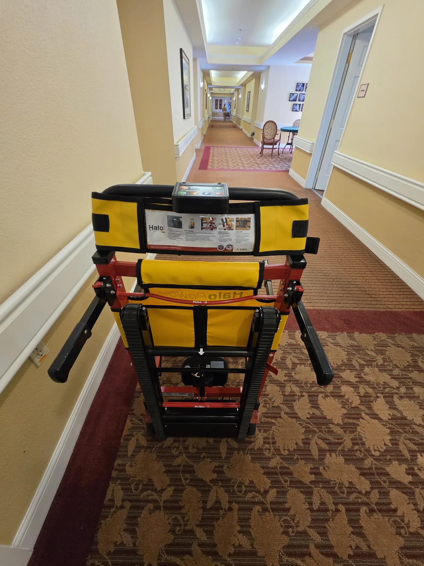 A HALO evacuation chair staged in a hotel corridor